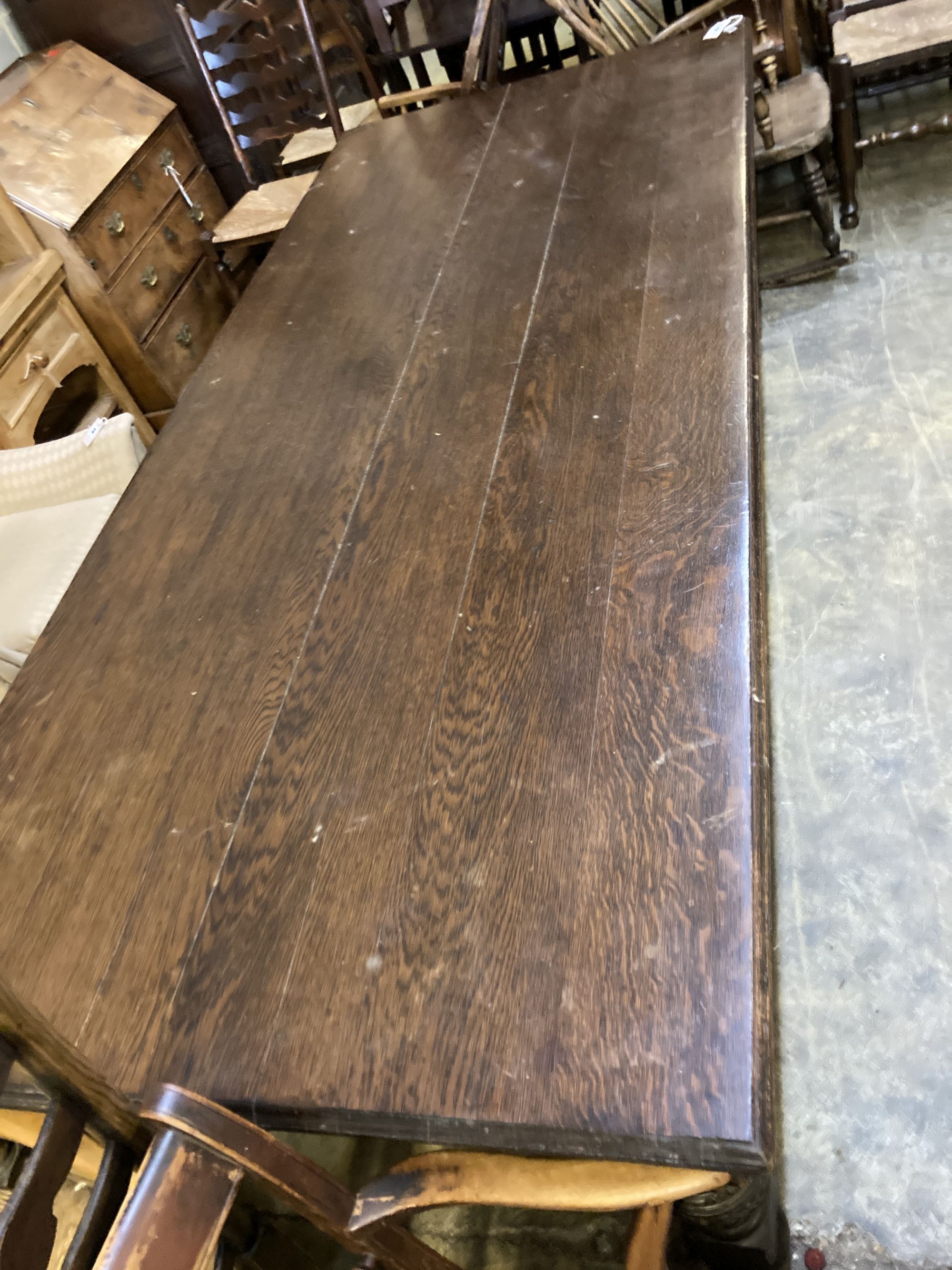 A Victorian oak refectory dining table, on carved bulbous legs, length 244cm, depth 104cm, height 74cm